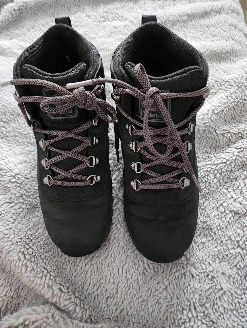 Women's Timberland Black Boots with Gray Laces.